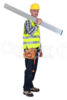 Tradesman carrying a girder