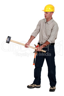 Tradesman holding a mallet