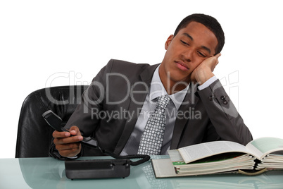 Bored businessman making phone calls