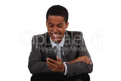 Businessman smiling at his phone