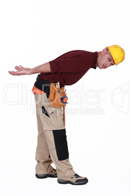 Construction worker with an imagined heavy load