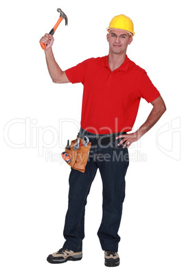 Young handyman raising hammer in the air