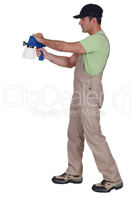 Man using paint sprayer