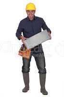 Builder carrying breeze block