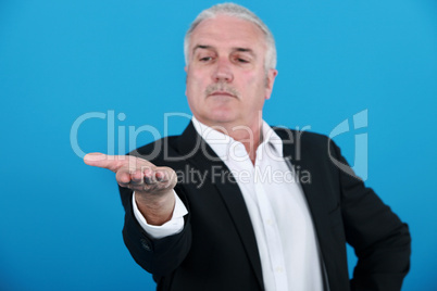 businessman looking at his hand