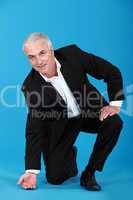 Businessman touching the floor