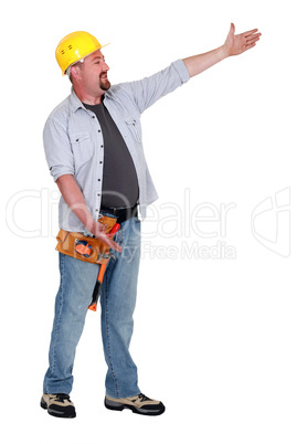 Tradesman presenting an invisible object