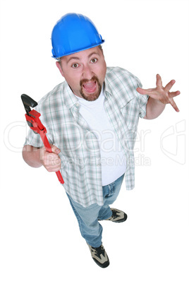 Surprised tradesman holding a pipe wrench