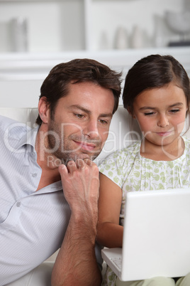Father and daughter on the computer