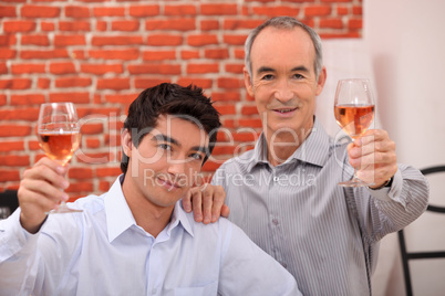 Two men drinking rose