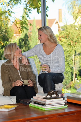 Mother and daughter chatting at home