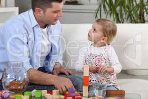 Father playing with daughter