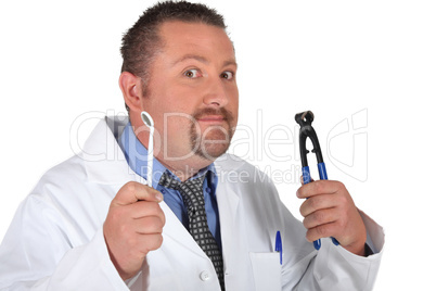 Dentist holding a mirror and a pair of pliers