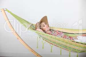 Woman lying relaxing in hammock