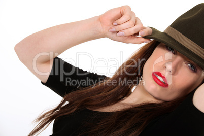 Mysterious woman wearing a Fedora hat