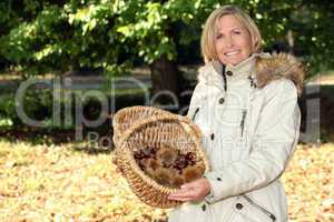 Woman gathering chestnuts