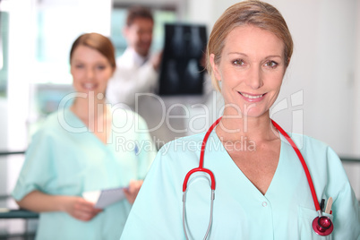 Female nurse in X-ray room.