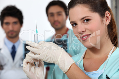 Nurse holding needle