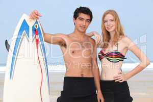 Couple with surfboard