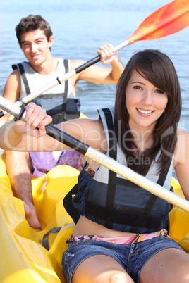 Couple kayaking on a warm summer's day