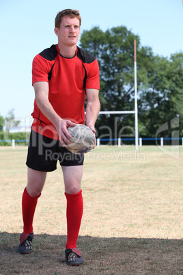 man playing rugby