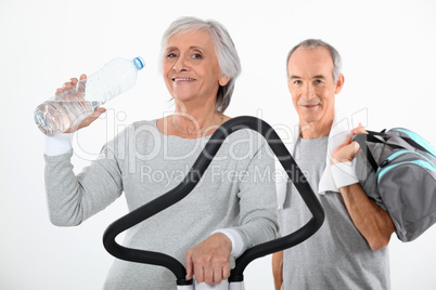 Elderly couple working out together