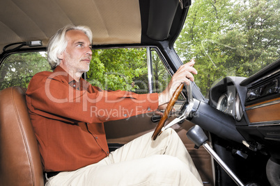 man in his car