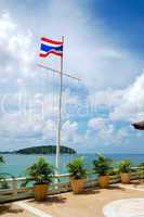 Terrace with sea view and Thai flag at luxury hotel, Phuket, Tha