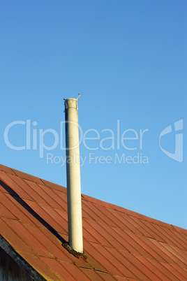 Chimney on an old tinny roof