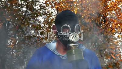 Man in gas mask in fog
