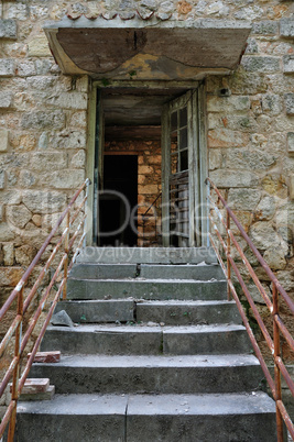 crumbling staircase broken door