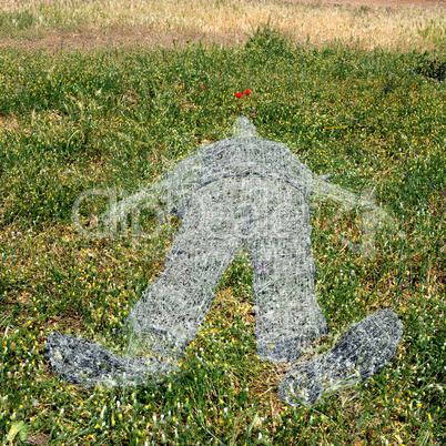 human figure imprinted on grass