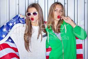 Beautiful patriotic girls with lollipops