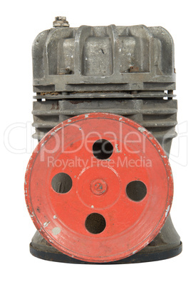 Old air compressor with pulley (isolated)