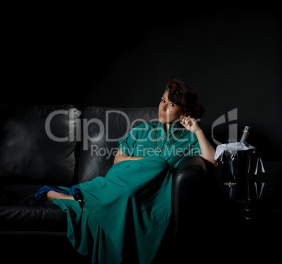 Beautiful girl sitting on a sofa