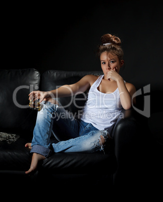 Portrait of a woman with a glass of alcohol