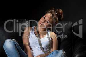 Beautiful girl sitting on a sofa