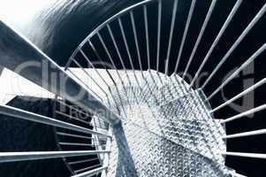 Looking down a metal spiral staircase