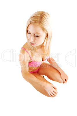 Girl crouching on floor.