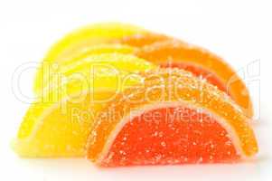 Colored marmalade (slices) on a white background