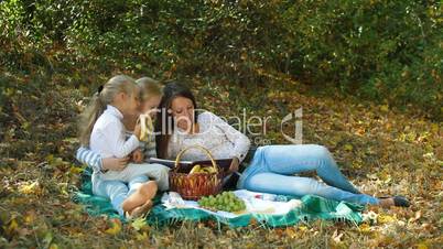 Mother and Daughters In The Park