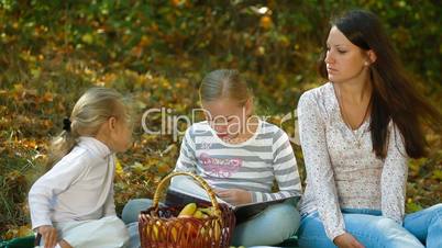 Family At Picnic In The Autumn Park