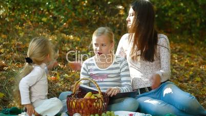 Mother And Children Spending Time Together In The Park