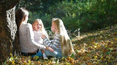 Cheerful Young Family In The Park