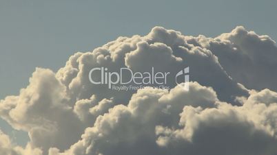 Cumulus clouds inflate