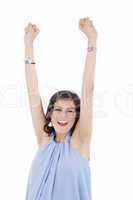 Portrait of a an excited young woman celebrating success over wh