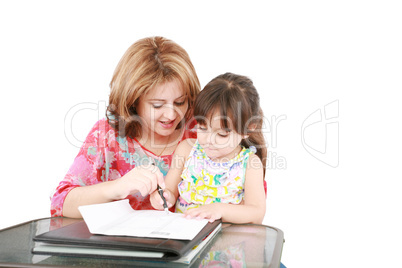 Mother and daughter doing homework at home