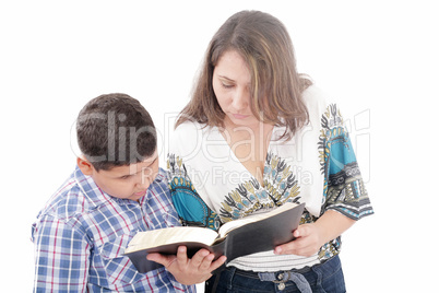 Mother and son reading a Bible over a black background