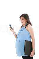 a pregnant woman texting on her cell phone with a happy expressi