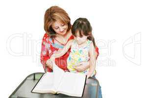 Minority woman and her daughter reading the Bible